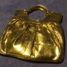 Metallic Gold Tone Snakeskin Bag. Blue Interior, Zip Closure. Great Condition! Never Used Designer Gold Satchel Shoulder Bag, Designer Gold Bag With Detachable Handle, Designer Gold Bag With Handle Drop, Designer Gold Satchel Bag, Designer Gold Satchel For Formal Occasions, Designer Gold Top Handle Satchel, Gold Leather Handheld Evening Bag, Luxury Gold Bag With Top Carry Handle, Luxury Gold Satchel Bag