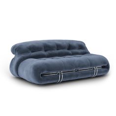 a blue couch sitting on top of a white floor