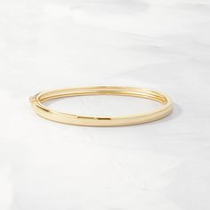 This stunning solid bangle bracelet is super trendy and stylish! It's comfortable and lightweight. Looks great stacked or on its own! We use a THICK plating of 14k Gold or Rhodium over 925 Sterling Silver Super high-quality & lightweight Available in 5.5", 6", 6.25", 6.75", 7", 7.5", or 8" Latch Closure 4mm thick N Everyday Stackable Gold Bangle Bracelet, Everyday Stackable Bangle, Modern Stackable Bangle For Everyday, Modern Hoop Bangle For Everyday Wear, Modern Hoop Bangle For Everyday, Elegant Hoop Cuff Bracelet For Everyday, Modern Stackable Round Bangle, Classic Hypoallergenic Bangle Bracelets, Elegant Hypoallergenic Bangle For Everyday Wear