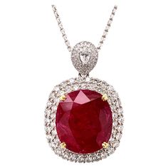 Glamorous large ruby diamond pendant necklace. Intense fiery red, high luster, cushion faceted, 24.21 carats natural ruby mounted in high profile with yellow gold eight knife prongs, accented with two rows of round brilliant cut diamonds, bail with pear faceted and cluster diamonds. Beautiful handcrafted design set in 18 karats. Chain is not included. Statement piece! Ruby: 24.21 carats, intense fiery red, high luster, cushion faceted Diamond: 3.45 carats, round brilliant cut Color: G-H Clarity: Luxury Red Necklace With Prong Setting, Luxury Ruby Necklaces With Polished Finish, Luxury Red Necklaces With Single Cut Diamonds, Luxury Ruby Teardrop Pendant Jewelry, Luxury Ruby Faceted Necklaces, Luxury Red Brilliant Cut Necklace, Ruby Diamond Necklace, Ruby Diamond Pendant, Pink Diamond Earrings