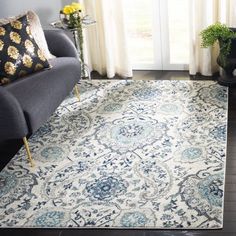 a blue and white rug in a living room