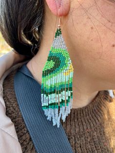 Green Fringe Beaded Drop Earrings, Unique Green Long Drop Earrings, Green Long Drop Earrings, Green Dangle Tassel Earrings With Fringe, Green Dangling Bead Chandelier Earrings, Green Tassel Drop Earrings With Dangling Beads, Green Bohemian Beaded Dangle Earrings, Green Fringe Drop Earrings, Green Fringe Dangle Jewelry