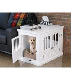 a dog sitting in a small white crate