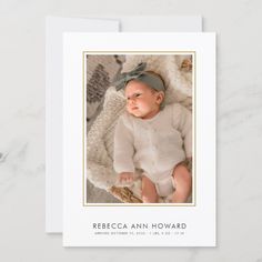 the birth announcement card features an image of a baby wearing a white sweater and blue headband