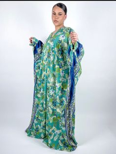 Kaftan made with floral Satin fabric  fabric. Made with floral crepe fabric. Fabric does not stretch.  Polyester  Care Instructions: Machine Wash and Air Dry or Dry Clean only. Green Floral Print Maxi Kaftan, Patterned Dresses With Floral Print And Kimono Sleeves, Patterned Dress With Floral Print And Kimono Sleeves, Green Floral Print Tunic Kaftan, Green Floral Print Rayon Maxi Dress, Long Floral Print Patterned Kaftan, Green Floral Rayon Maxi Dress, Long Floral Patterned Kaftan, Long Patterned Kaftan With Floral Print