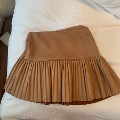 Super Cute Skirt. Never Worn. Amazing For Fall Spring Pleated Brown Skort, Brown Pleated Mini Skirt For Spring, Pleated Brown Mini Skirt For Spring, Chic Brown Skirted Bottoms, Chic Brown Ruffled Mini Skirt, Brown Fitted Pleated Skirt With Lining, Fitted Lined Brown Pleated Skirt, Fitted Brown Pleated Skirt, Brown Pleated Tiered Skirt