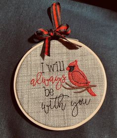 a red bird is sitting on a branch with the words i will always be with you