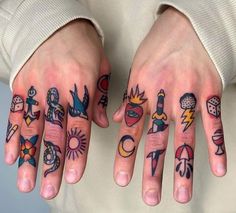 two hands with different tattoos on them