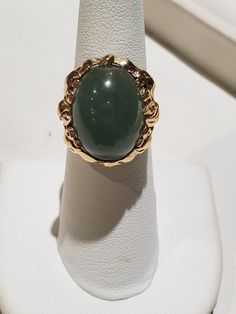 You are viewing a beautiful 14k mings green translucent jade cabochon ring. The total weight of the ring is approx.8.6 grams. The ring size approx.5 3/4 can size up or down. The ring itself measures approx.21mm x 19mm wide. Beautiful green jade translucent cabochon. Send me a message if you have any question. MAKE AN OFFER Yellow Gold Jade Cabochon Ring, Green Oval Cabochon 14k Stamped Jewelry, Gold Jade Cabochon Rings, Green Emerald Oval Cabochon Ring Stamped 14k, 14k Gold Green Gemstone Dome Ring, Gold Rings With Jade Cabochon, Formal Green 14k Gold Dome Ring, Formal Yellow Gold Jade Ring, Formal Green Opal Ring In 14k Gold