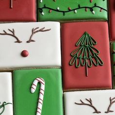 christmas cookies decorated with icing and candy canes are arranged in squares on top of each other