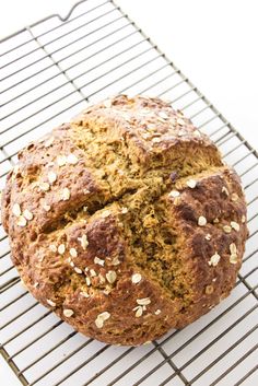 a loaf of bread sitting on top of a cooling rack