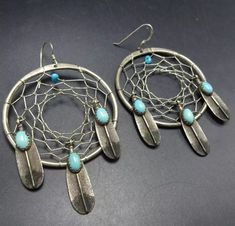 VINTAGE NAVAJO STERLING SILVER DREAM CATCHER EARRINGS with FEATHER DANGLES DESCRIPTION:  These powerful earrings will be a cherished addition to your collection of quality vintage Southwestern and Native American jewelry. Earrings measure 2 3/4" (including wires) x 1 3/4" WEIGHT: 16.8 grams SIGNED: HLW STERLING:    yes, stamped STERLING Dream Catcher Earrings, Vintage Navajo, Native American Jewelry, Vintage Signs, Dream Catcher, Favorite Jewelry, Jewelry Earrings Dangle, Dangle Drop Earrings, Dangle Earrings