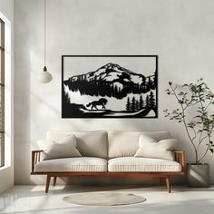 a living room filled with furniture and a painting on the wall