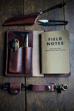 Combining the best aspects of all our leather EDC slips, The Ranger is the ultimate pocket organizer. The main body of the Ranger is a journal cover that will fit standard pocket notebooks such as Field Notes, Moleskine Cahier or similar. On the inside cover are two tool slots for your favorite pocket knife and tucked behind that is a minimalist card wallet slot.What makes our EDC pocket organizers stand out? Each one is crafted from full grain leather and entirely hand stitched for a lifetime o Leather Pocket Organizer, Minimalist Card Wallet, Mens Leather Accessories, Minimalist Card, Minimalist Cards, Field Notes, Pocket Notebook