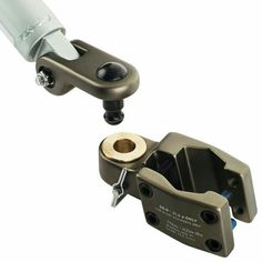 two different types of clamps are shown in this image, one is black and the other is silver