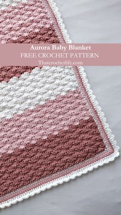 a pink and white crocheted blanket with the text aurora baby blanket free crochet pattern