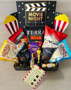 the movie night gift box is filled with snacks