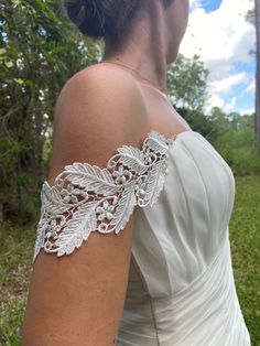 "READ BEFORE PLACING YOUR ORDER: - Buy samples of similar lace here: https://www.etsy.com/listing/190961642/sampleswatch-lace-chiffon-ribbon-or?ga_search_query=sample&ref=shop_items_search_1 - My stock is very limited and the order are made after they are placed. - THIS IS A CUSTOM ORDER I don't accept returns. - Read the reviews. You bought your dream dress but it doesn't have straps! No problem. I can made them for you. I'll try my best to match it as much as possible to your dress so they will look like part of the original design and you will feel happier with the result! Beautiful off the shoulder straps made of embroidered rayon ivory color lace. 3\" widest part. Length is 17\"  It will have one side of the snaps attach to both ends and the other side for you to attach to your dress Silver Fitted Bridal Accessories, Fitted Lace Bridal Belt For Bride, Fitted Lace Bridal Belt For Ceremony, Fitted Lace Bridal Accessories For Bride, Lace Bridal Accessories Fitted For Mother Of The Bride, Fitted Lace Bridal Accessories For Mother Of The Bride, Fitted Lace Trim Bridal Accessories For Bride, Fitted Wedding Lace With Lace Back, Fitted Lace Back Dress For Weddings