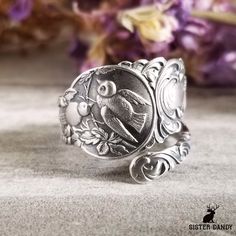 To see all of our bird rings: https://www.etsy.com/shop/SisterDandy?search_query=bird Who doesn't love sparrows! A detailed and beautiful love bird spoon ring, originally a pattern made in the early 1900s, featuring an intricate pair of birds nestled in their tree home. Perfect gift for the nature and bird lover in your life! This ring is made from a vintage sterling silver spoon, 925, nickel-free. This ring will be adjusted to the size you request but it can easily be tightened or loosened at h Whimsical Silver Wedding Rings, Bohemian Silver Jewelry With Bird Design, Silver Bohemian Jewelry With Bird Design, Silver Bird Shaped Jewelry For Gifts, Silver Bird Ring, Silver Bird-shaped Jewelry As Gift, Bird Ring, Bird Rings, Sterling Silver Spoons