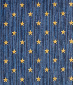 the blue and yellow stars pattern is shown in this fabric design, which has been made from