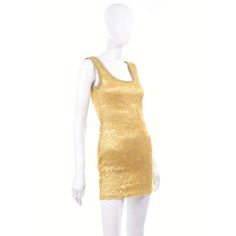 For Sale on 1stDibs - This is a stunning vintage metallic gold stretch lace dress from Bergdorf Goodman with the Gruppo GFT label. This designer dress was made in the USA and Fitted Gold Lace Dress, Fitted Gold Mini Dress, Gold Mini Dress For Formal Occasions, Gold Mini Dress For Festive Occasions, Elegant Fitted Gold Lace Dress, Glamorous Fitted Lace Summer Dress, Glamorous Fitted Lace Dress For Summer, Fitted Glamorous Lace Dress For Summer, Gold Mini Dress For Formal Summer Events