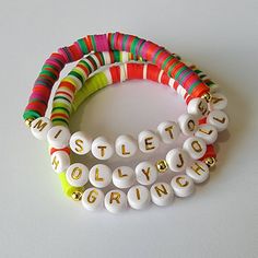 🎄 The listing is for Individual Christmas bracelets. These beauties can be worn by themselves, or as a stack!  I offer a variety of sizes from xs to xxl. You can find instructions on how to easily measure your wrist! 🎄All bracelets are FINAL SALE as these are custom orders. Please double check your bracelet size for optimal comfort fit  🎄 CARE INSTRUCTIONS: - Avoid contact with water to improve longevity. -Roll bracelets onto your wrist to avoid over stretching. If you have any questions or specific requests, please feel free to reach out in my messages! I will get back to you ASAP! DONT FORGET TO TAG ME ON INSTAGRAM WITH YOUR STYLING!!  https://www.instagram.com/theruffledpebble/ Holiday Word Bracelets, Grinch Christmas Bracelet, Holly Jolly Christmas Bracelet, Mistletoe Christmas Brac Christmas Beaded Bracelets, Holiday Words, Word Bracelet, Christmas Bracelet, Christmas Accessories, Grinch Christmas, Holiday Jewelry, Christmas Jewelry, Holly Jolly