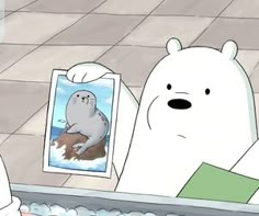 there is a polar bear that is looking at a picture on the shelf in front of him