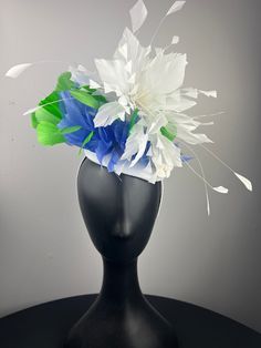 A white button base with a white feather crown, with bold lime green and periwinkle feathers, finished with pretty white vintage velvet flowers. Sits on a comfortable white headband. Lightweight and easy to wear. Ships in a high quality storage box. One of a kind.  Perfect for Kentucky Derby, Royal Ascot, church, weddings, just for fun. White Mini Hat Headband For Kentucky Derby, White Headband Mini Hat For Kentucky Derby, White Spring Mini Hat Headband, White Handmade Flowers Headpiece For Kentucky Derby, White Flower Hat For Royal Ascot, White Summer Fascinator With Handmade Flowers, White Fascinator With Handmade Flowers For Royal Ascot, White Handmade Flowers Fascinator For Royal Ascot, White Handmade Flower Fascinator For Kentucky Derby