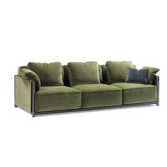 a green couch with pillows on it