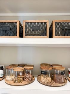 the shelves are filled with spices and jars