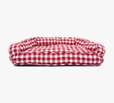 a red and white checkered dog bed