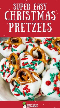 christmas pretzels with white frosting and sprinkles are on a plate