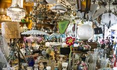 a room filled with lots of glass vases and lamps