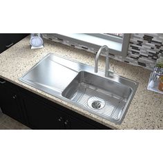 An Elkay Lustertone Classic stainless steel sink looks as great on day 3, 000 as it does on day one. The rich, uniform grain is scratch resistant for heavy-duty use, whether it's a kitchen sink or a prep, bar, laundry or commercial sink. Light scratches, which occur with everyday use, naturally blend into the finish of this Durable sink with time. Deeper scratches are repairable with an Elkay stainless steel restoration kit. Available in ADA depths. Elkay Gourmet Drop-In 43-in x 22-in Lustertone Kitchen Sink Drainboard, Sink With Drainboard, Sink Light, Drainboard Sink, Commercial Sink, Drop In Kitchen Sink, Kitchen Sink Stainless Steel, Sink Grid, Drop In Sink