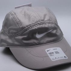 Nike Air Tailwind 5 Panel Nathan Bell Running Hat Cap Size: Unisex Adjustable Color: Gray Sku: Dm8457-033 Condition: New With Tags Casual Windproof Bucket Hat, Spring Sports Baseball Cap With Short Brim, Casual Windproof Visor Hat, Casual Windproof Baseball Cap With Curved Brim, Casual Windproof Visor Baseball Cap, Casual Windproof Sun Hat With Curved Brim, Nike Breathable Baseball Cap, Nike Outdoor Baseball Cap With Curved Brim, Nike Curved Brim Baseball Cap For Outdoor