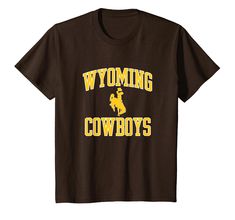 PRICES MAY VARY. Fan favorite Wyoming Cowboys kid's apparel short sleeve shirt that is a great addition to any Wyoming fans wardrobe, making it a perfect gift for Christmas or graduation This Wyoming kid's short sleeve shirt has a high quality digitally printed graphic perfect for any Cowboys fan that loves the classic design. Each shirt is officially licensed by The University of Wyoming Lightweight, Classic fit, Double-needle sleeve and bottom hem Cowboys Apparel, University Of Wyoming, Wyoming Cowboys, Cowboys Men, Cowboy Outfits, Mens Short Sleeve Shirt, Men's Apparel, Gift For Christmas, Kids Shorts