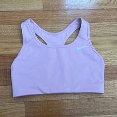 Nike Sports Bra In Size Medium. Medium Impact Non Padded Sports Bra. Color Is A Light Pink. Never Worn. Comes From A Smoke Free Home. Nike Solid Color Sports Bra, Nike Solid Sports Bra For Sports, Nike Sports Bra For Spring, Nike Spring Sports Bra, Nike Sporty Sports Bra For Spring, Nike Sports Bra For Spring Sports, Nike Pink Casual Sports Bra, Casual Pink Nike Sports Bra, Nike Casual Athletic Fit Sports Bra