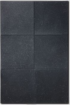 four black tiles with white speckles on them