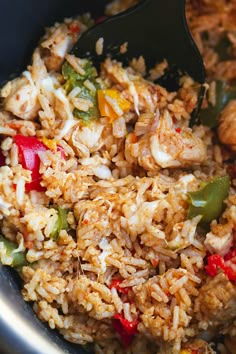 a close up of rice and vegetables in a pot