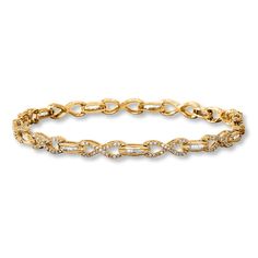 Bars of baguette diamonds sparkle between infinity signs shimmering with round diamonds in this fabulous bracelet for her. Styled in 10K yellow gold, the 7.25-inch bracelet has a total diamond weight of 1 carat and fastens with a tongue clasp. Infinity Signs, Bracelet For Her, Gold Stock, Jewelry Education, Jewelry Advice, Baguette Diamonds, Gemstone Bracelets, Diamond Stone, 1 Carat