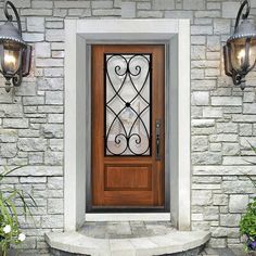 the front door is decorated with wrought iron