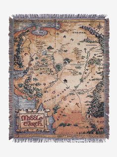 a blanket with a map on it and fringes hanging from the bottom, in front of a white background