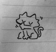 a drawing of a cat sitting on top of a piece of paper