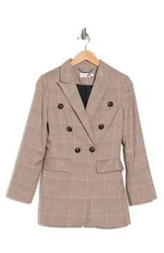 Elevate your wardrobe with this plaid peak lapel blazer featuring a double-breasted front and longer silhouette. 28.3" length (size S) Peak lapel Long sleeves Double-breasted closure Chest welt pocket Front flap pockets Plaid print Woven construction Lined Shell: 98% polyester, 2% spandex/lining: 100% polyester Machine wash Imported Model stats: 5'10" height, 32" bust, 25" waist, 36" hip. Model is wearing size S. Tailored Plaid Blazer For Spring, Plaid Blazer With Welt Pockets For Work, Spring Plaid Blazer With Lapel Collar, Plaid Notch Lapel Blazer For Work, Plaid Blazer With Button Closure For Workwear, Plaid Blazer With Suit Collar For Work, Plaid Notch Lapel Outerwear For Office, Spring Formal Plaid Blazer, Career Double-breasted Blazer Dress For Fall