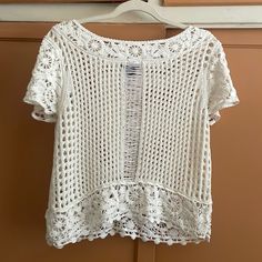 This Never Worn Off White/ Cream Color Crochet Short Sleeve Top . It’s Stretchy And Sits Just Sits Right At The Waist Crochet Top With Crochet Trim For A Day Out, Crochet Trim Top With Short Sleeves For Day Out, Crochet Trim Short Sleeve Top For Day Out, Summer Crochet Top With Crochet Trim, Summer Crochet Trim Short Sleeve Top, Summer Crochet Top With Pointelle Knit And Short Sleeves, Short Sleeve Knit Tops With Crochet Lace, Crochet Lace Knit Tops With Short Sleeves, Knit Lace Top For Summer