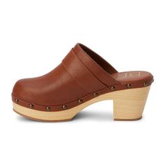 Vegan clog set on a faux wooden heel with stud detailing. Synthetic leather upper Manmade outsole 3 in / 7.62 cm heel 1.25 in / 3.18 cm platform Synthetic leather lining Padded insole Slip-on style Vegan Clogs, Oxford Pumps, Platform Clogs, Clog Heels, Shoe Insoles, Wooden Heel, Kids Sandals, Womens Clogs, Mule Clogs