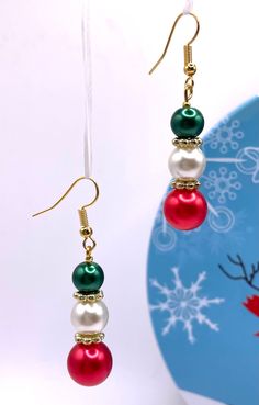 Merry Christmas and happy holidays!  Enjoy these beautiful, festive, Christmas, dangle, glass beaded earrings.  Festive to wear with any Christmas wardrobe whether it be a party or just a get together with friends!  Shipping is free.  Gift as a gift or keep as a gift for yourself!!  Great stocking stuffer too Holiday Beaded Jewelry, Handmade Holiday Jewelry, Christmas Jewelry Diy, Christmas Wardrobe, Merry Christmas And Happy Holidays, Earring Inspo, Wire Bangle Bracelets, Holiday Beading, Wire Bangles