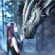 a woman is touching a dragon's head with her hand in front of it