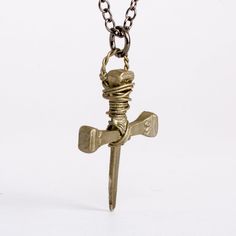 This Men's Knights Templar Bronze Nails Cross Pendant Necklace is hand crafted and cast in the finest jeweler's bronze. The cross makes a great gift for men or boys. Also great for First Communion or Confirmation gift.A dark patina has been applied to the cross by hand to create the rustic vintage look.Size of pendant: Height: 1 1/4 inches (32 mm) Width: 1 inches (25 mm)NOTE: Each cross is entirely made by hand, therefore each one is unique and can differ slightly from the example show here. Nec Vintage Metal Cross Pendant Necklace, Symbolic Metal Necklaces With Antique Finish, Vintage Metal Crucifix Necklace, Gold Cross Necklace With Oxidized Finish, Gold Necklace With Oxidized Cross Pendant, Bronze Engraved Cross Necklace, Antique Bronze Cross Pendant Jewelry, Antique Metal Cross Necklace, Engraved Bronze Cross Necklace