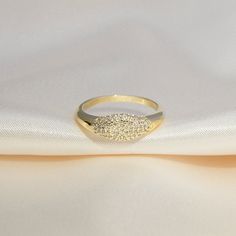 *Buy 2 items, Get 15% OFF your order. Coupon applied at checkout.* Make a sparkly statement with our signet pinky ring. A classic yet bold ring made with an extremely light-weight design. Best worn with our other daintier rings to create a layering effect. - 18k gold plated - Band Thickness: 7.5 mm. - 2 Year warranty GIFT WRAP AVAILABLE TO PURCHASE: https://www.etsy.com/listing/902780367/gift-wrap-for-gift-jewelry-pouch-jewelry?ref=shop_home_active_1&pro=1 HOW TO CARE FOR YOUR JEWELRY + All Stackable Rings With Sparkling Stones For Gift, Trendy Cubic Zirconia Promise Ring, Gold Oval Crystal Promise Ring, Round Rings With Sparkling Stones, Sparkling Crystal Promise Ring In Fine Jewelry Style, Gold Promise Ring With Sparkling Stones, Promise Ring With Sparkling Stones, Trendy Cubic Zirconia Rings For Gift, Trendy Cubic Zirconia Rings As Gift